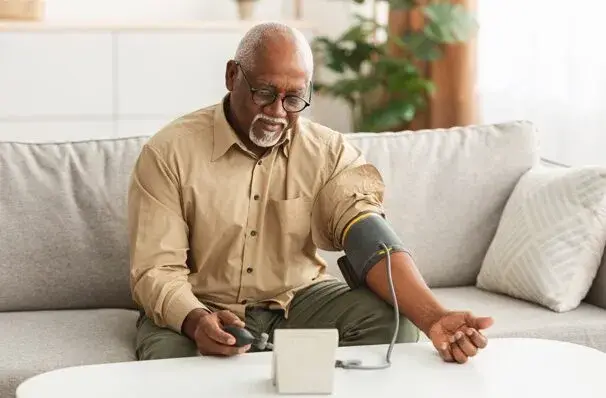 sec3-img-6 A healthcare provider reviewing patient data through remote monitoring